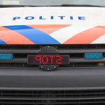 Stock – Logo politie op voorkant bus met stop bord aan